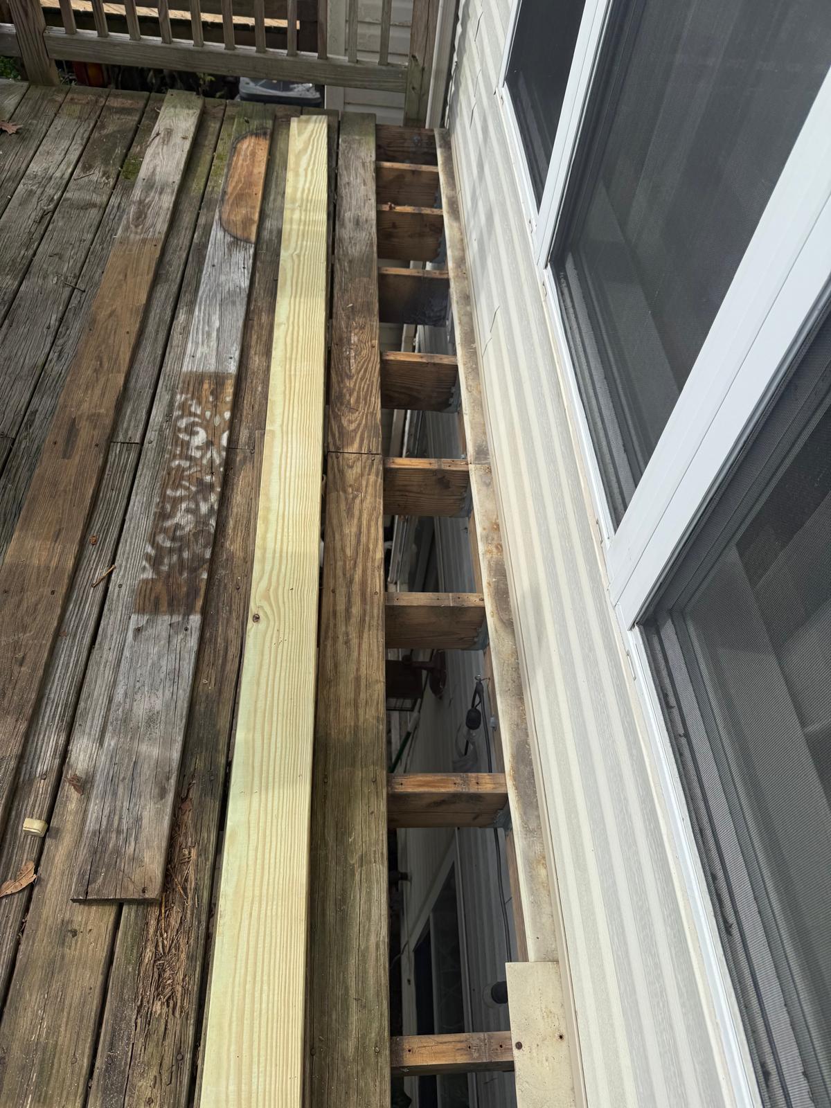 Exposed deck joists after old boards were removed