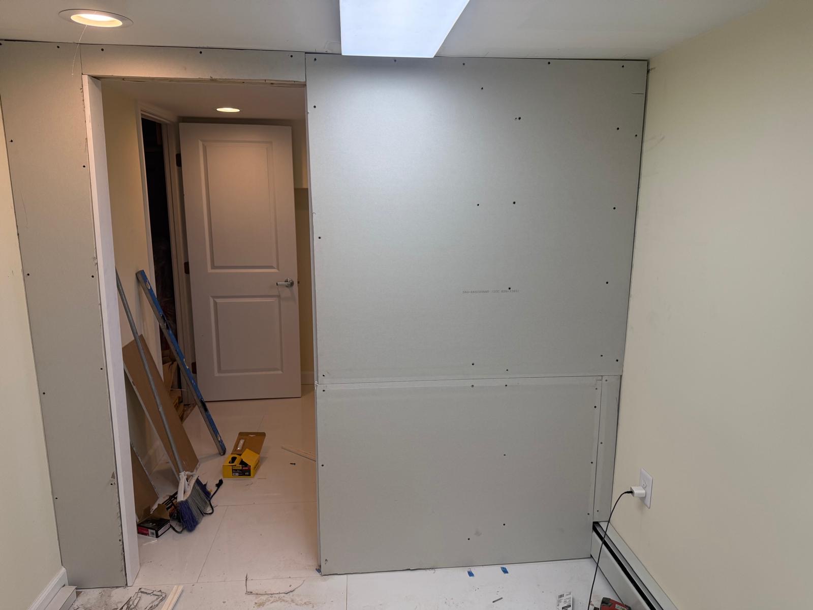 Newly hung drywall in an interior room