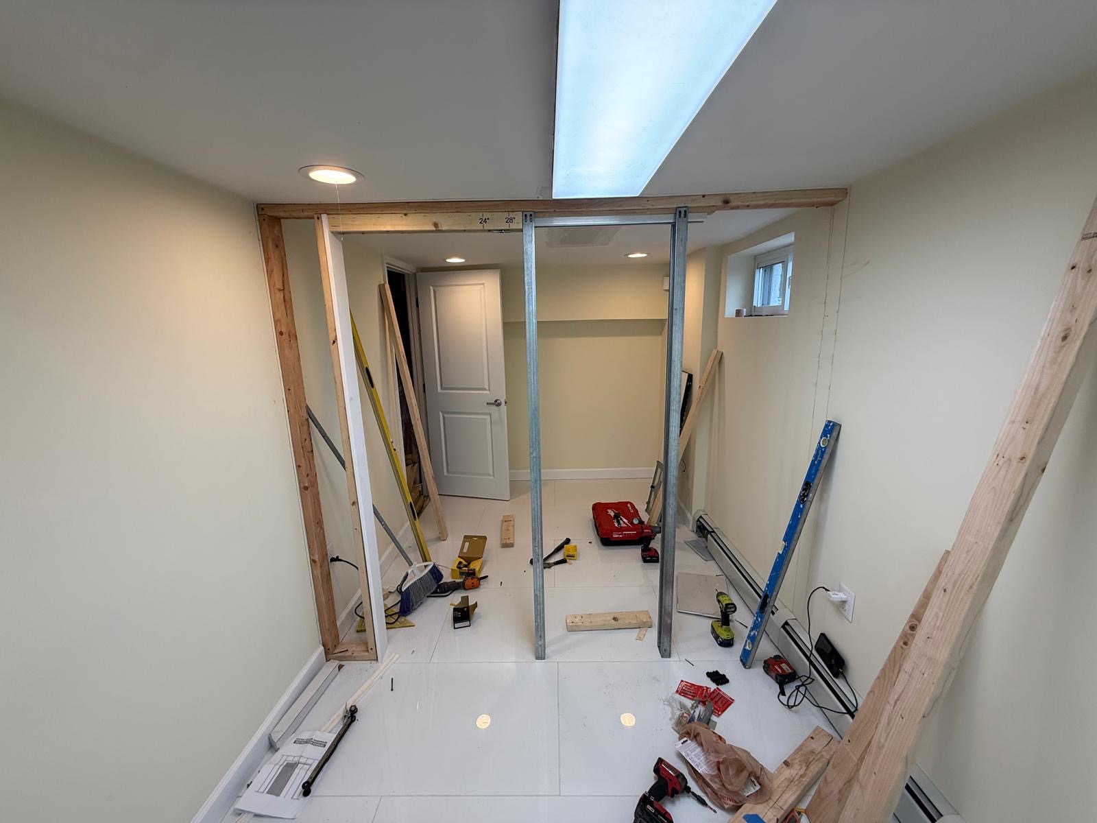 Interior wall framing over new tile flooring