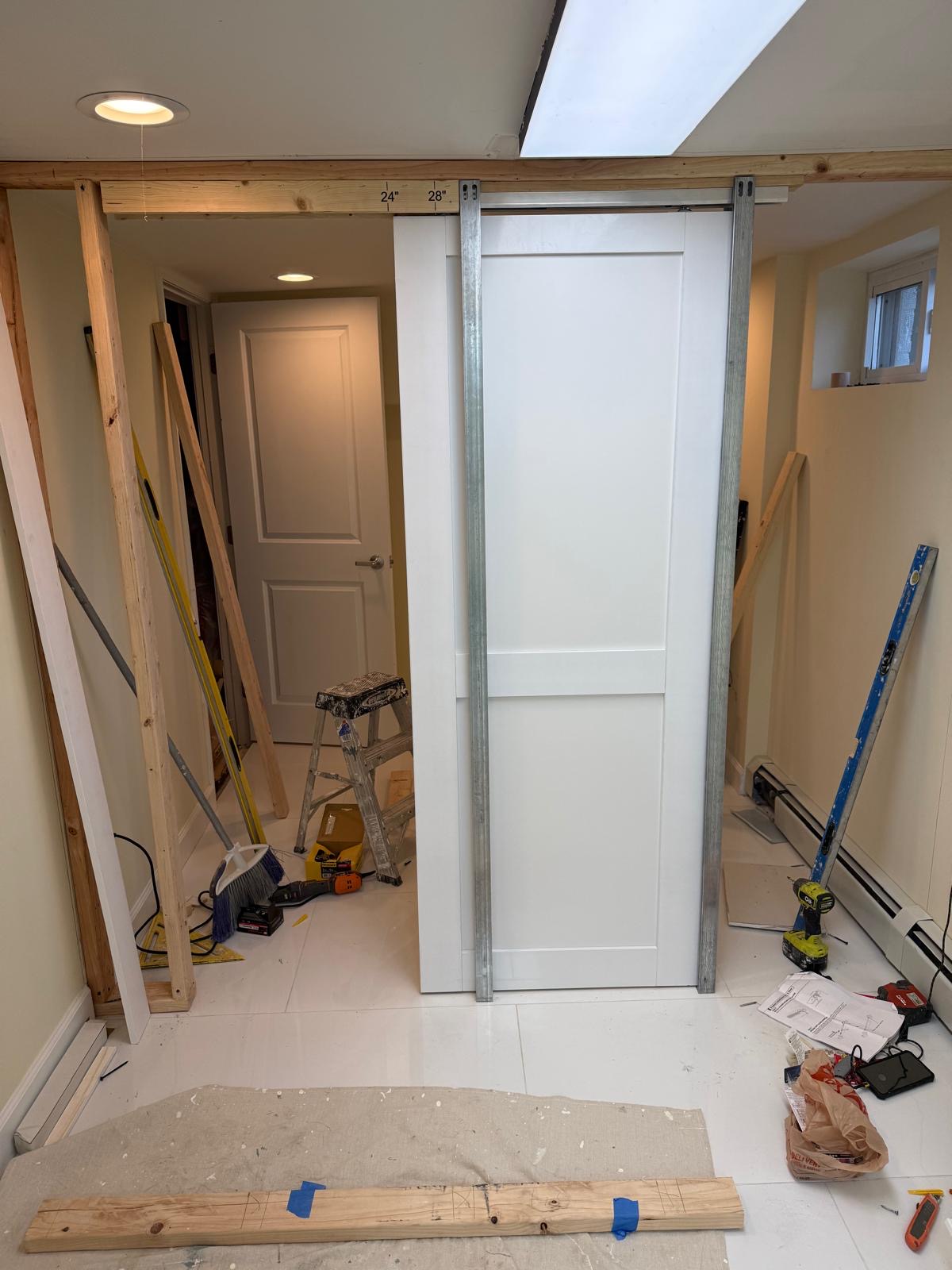 Pocket door installation with tools on site