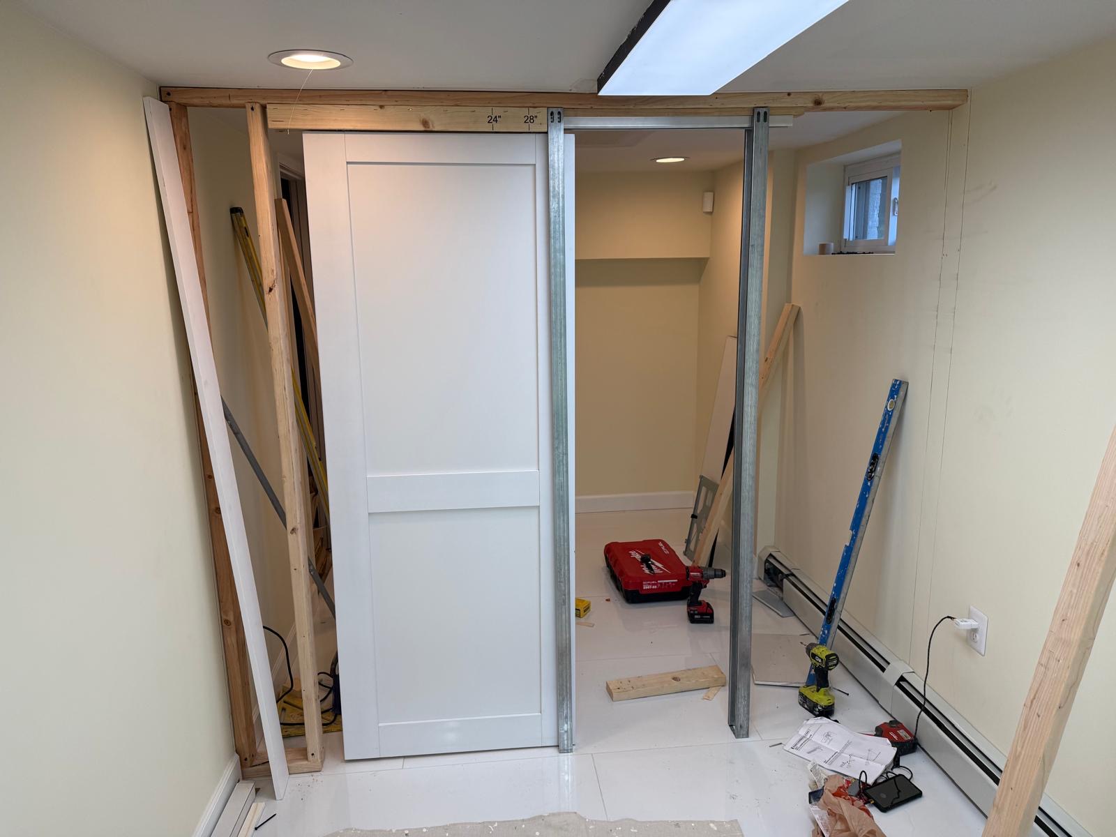 White pocket door being installed