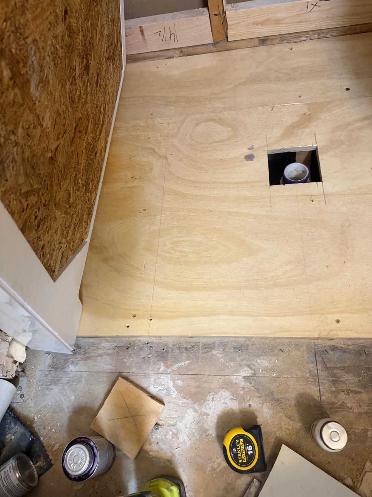 New plywood subfloor with a precise plumbing cutout